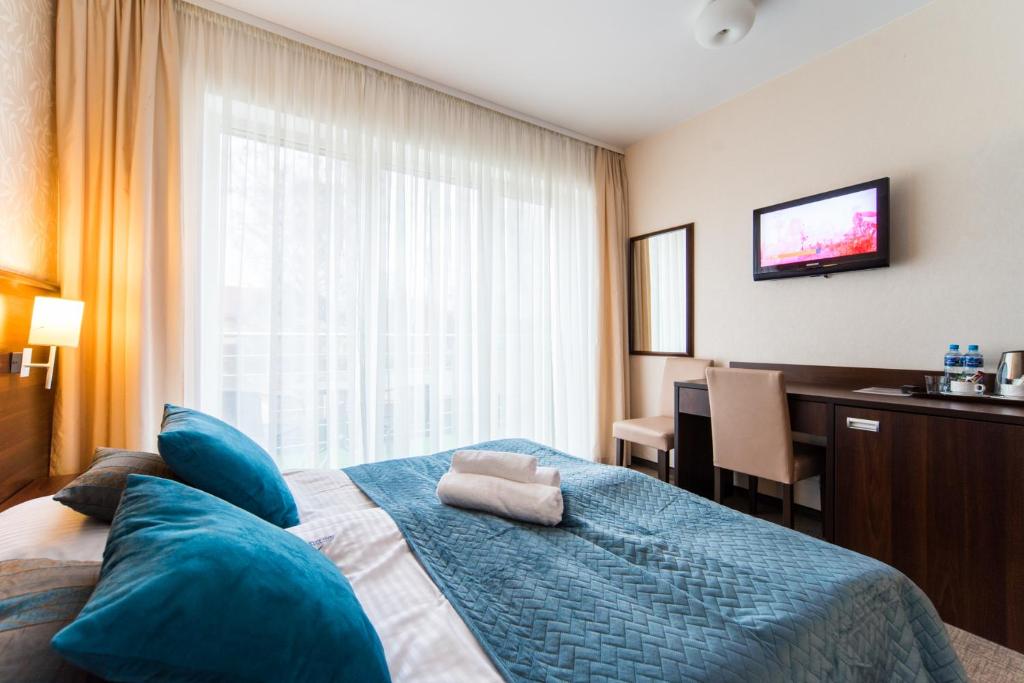 Postel nebo postele na pokoji v ubytování Villa nad Zalewem