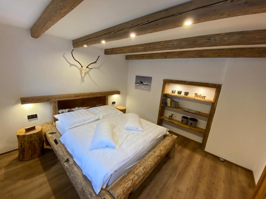 Postel nebo postele na pokoji v ubytování Chalet Apartments Maštal