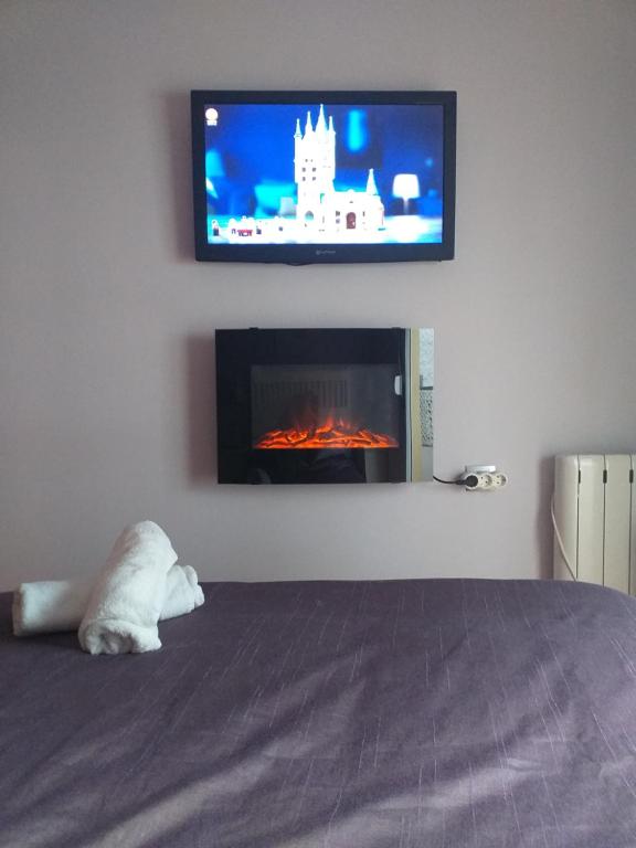 TV a/nebo společenská místnost v ubytování PLAZA NUEVA