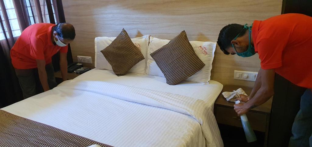 Postel nebo postele na pokoji v ubytování Hotel Sona