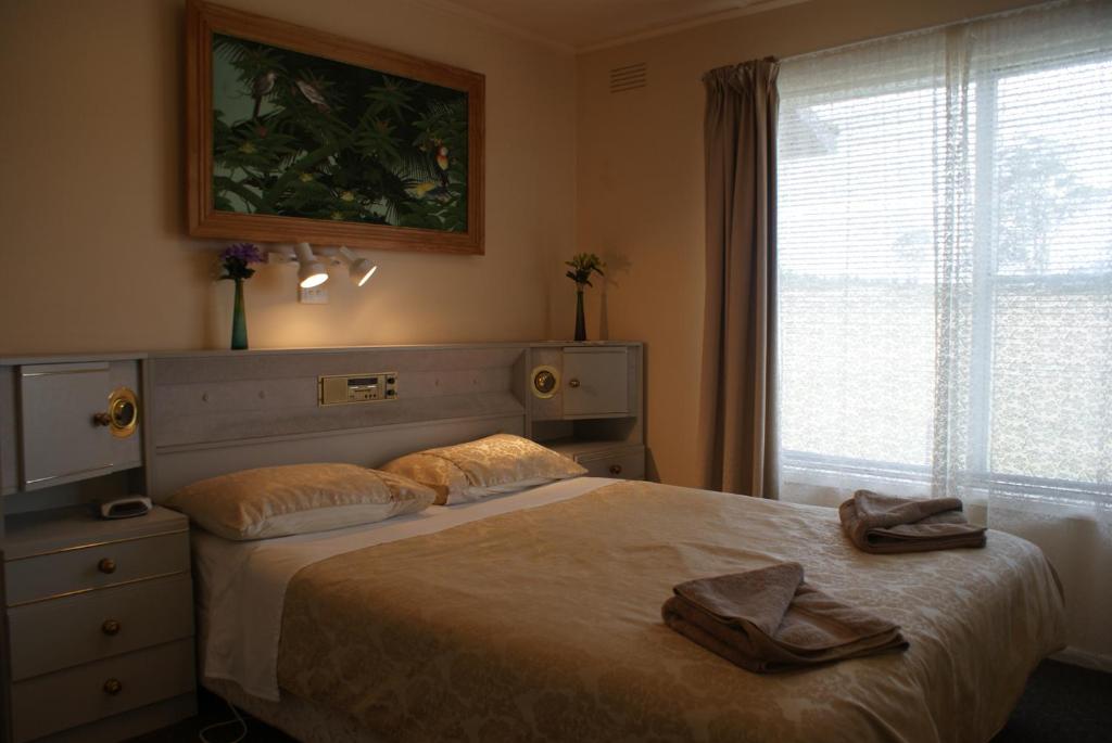 Postel nebo postele na pokoji v ubytování AAA Granary Accommodation