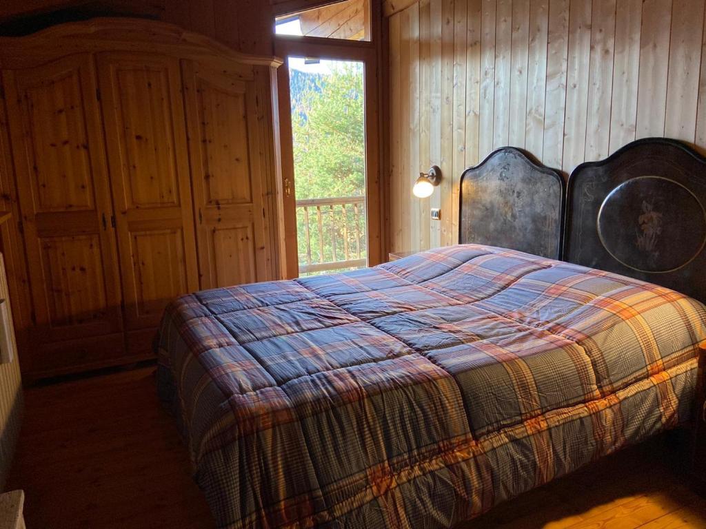 Postel nebo postele na pokoji v ubytování Eco Chalet Nonno Silvano