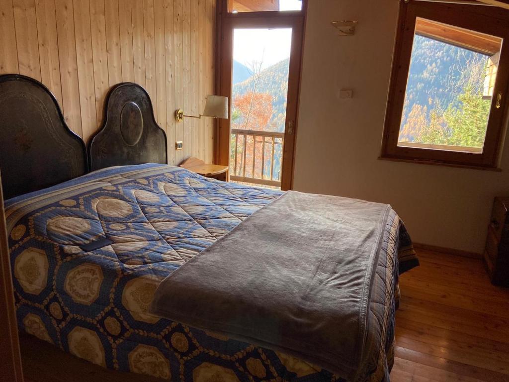 Postel nebo postele na pokoji v ubytování Eco Chalet Nonno Silvano