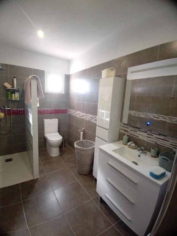 a bathroom with a sink and a toilet and a shower at Stefi in Candelaria