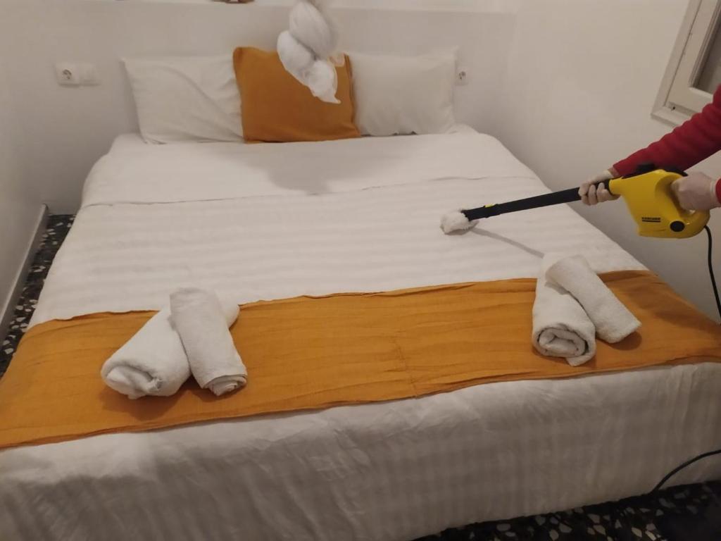 Postel nebo postele na pokoji v ubytování Kalymnos residence