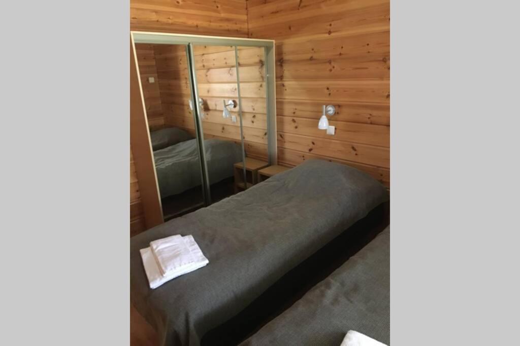 Postel nebo postele na pokoji v ubytování Vierumäki