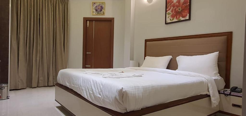 Postel nebo postele na pokoji v ubytování HOTEL FRIDAY INN