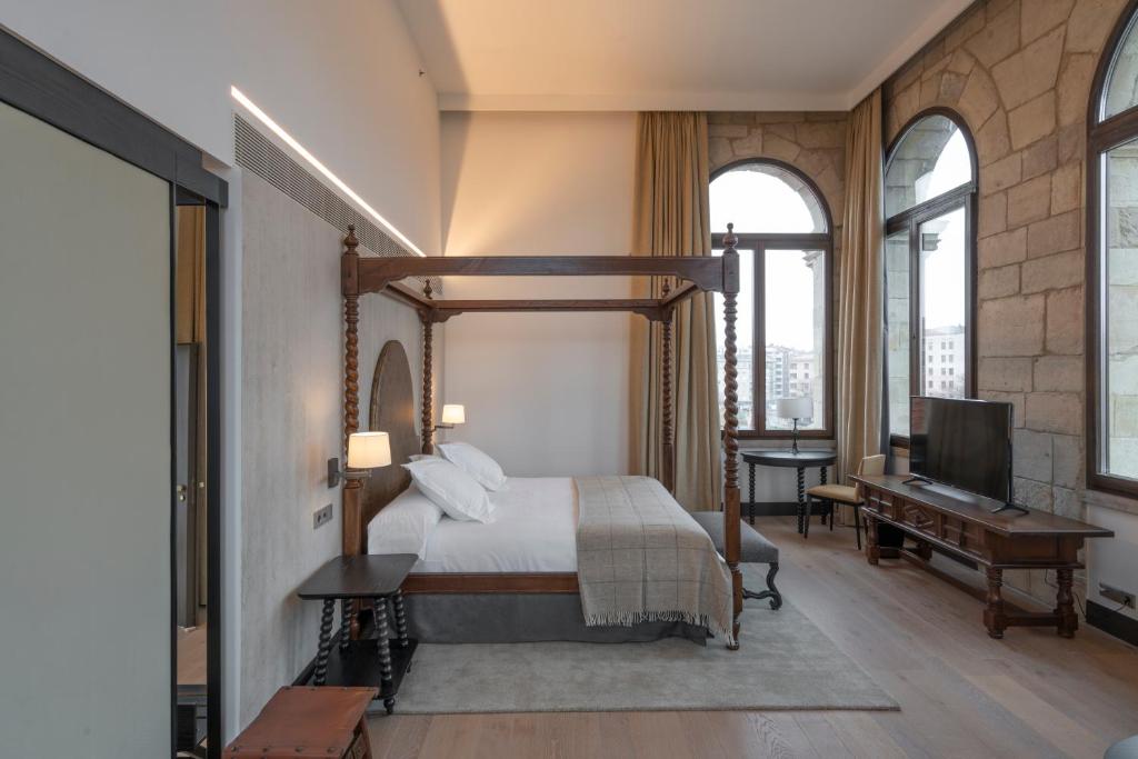 Postel nebo postele na pokoji v ubytování Parador de Turismo de León