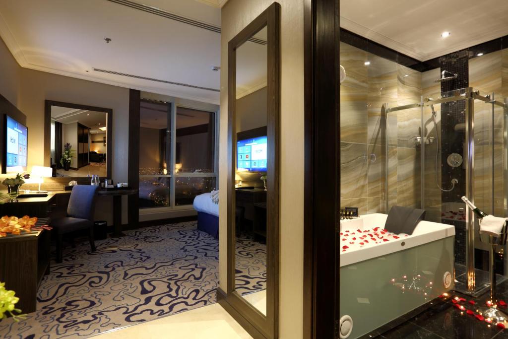 a hotel room with a view of a suite at Swiss Flora Royal Hotel Riyadh in Riyadh