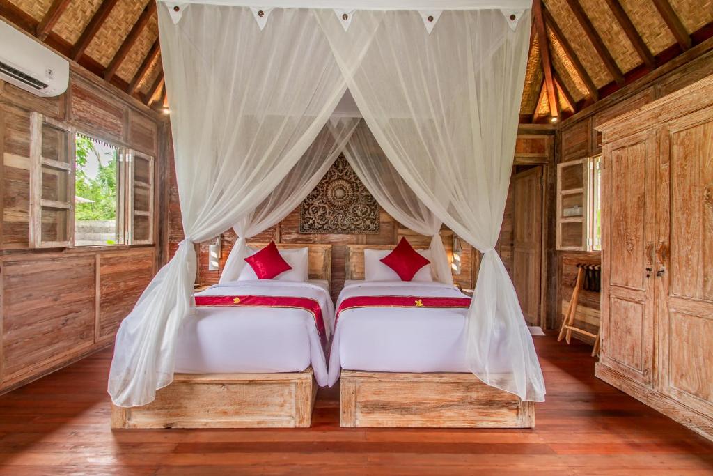 Postel nebo postele na pokoji v ubytování Aswanaya Villas Ubud