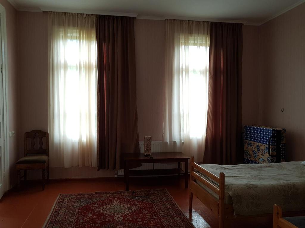 Postel nebo postele na pokoji v ubytování Garden House Mestia