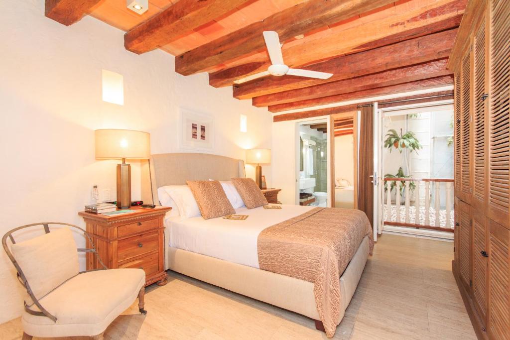 Postel nebo postele na pokoji v ubytování Hotel Boutique Casa del Coliseo