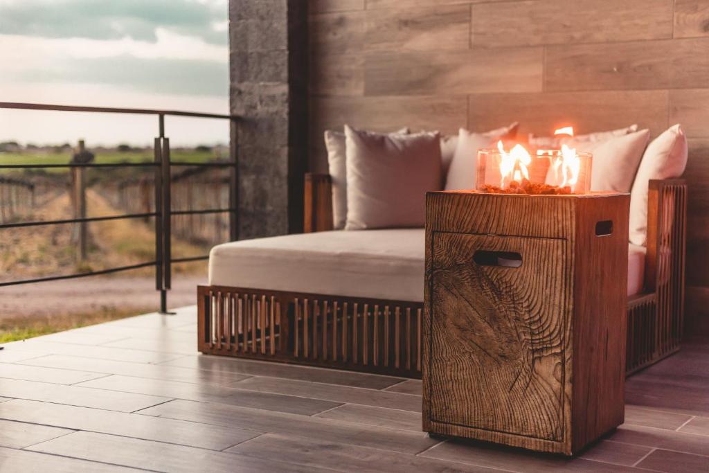 Postel nebo postele na pokoji v ubytování Casa Raíces Hotel Luxury & Viñedo