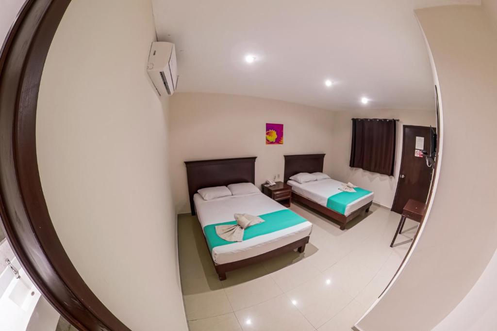 Postel nebo postele na pokoji v ubytování Hotel Villamar