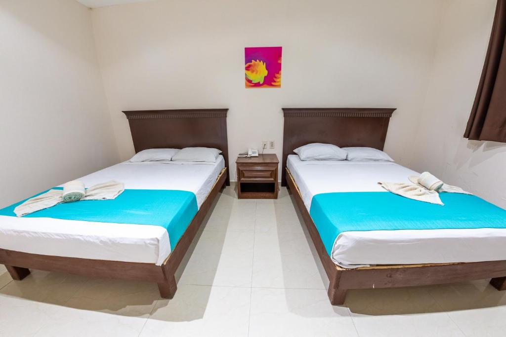 Postel nebo postele na pokoji v ubytování Hotel Villamar