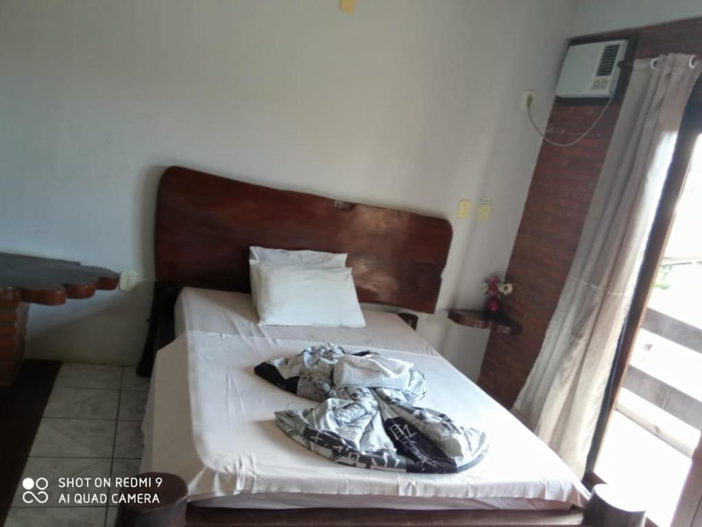 Postel nebo postele na pokoji v ubytování Pousada Kantuta