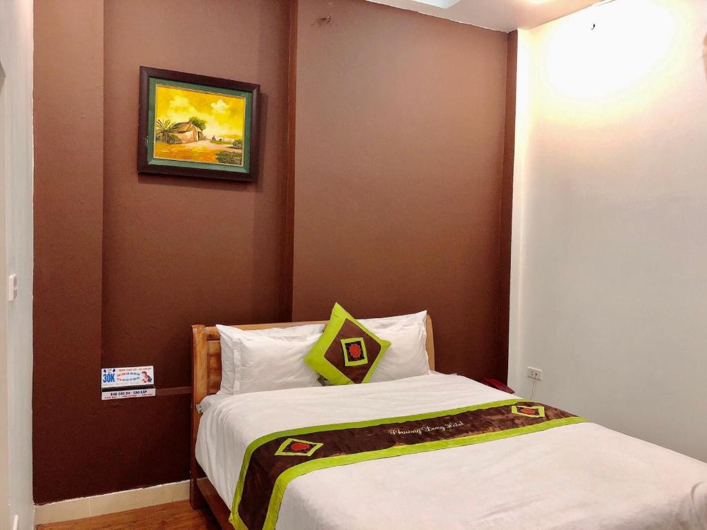 Postel nebo postele na pokoji v ubytování Phuong Dong hotel