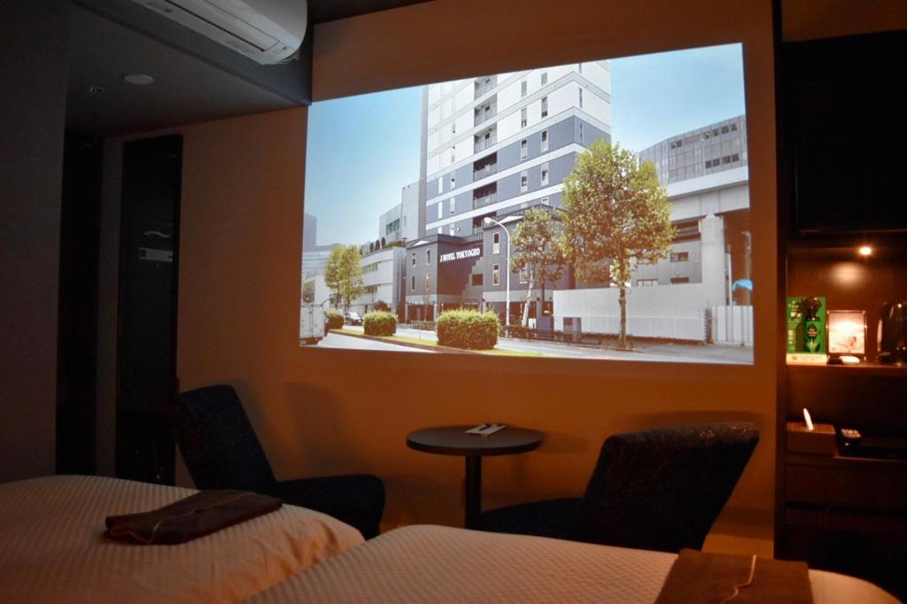 TV a/nebo společenská místnost v ubytování JHotelTokyoGEO