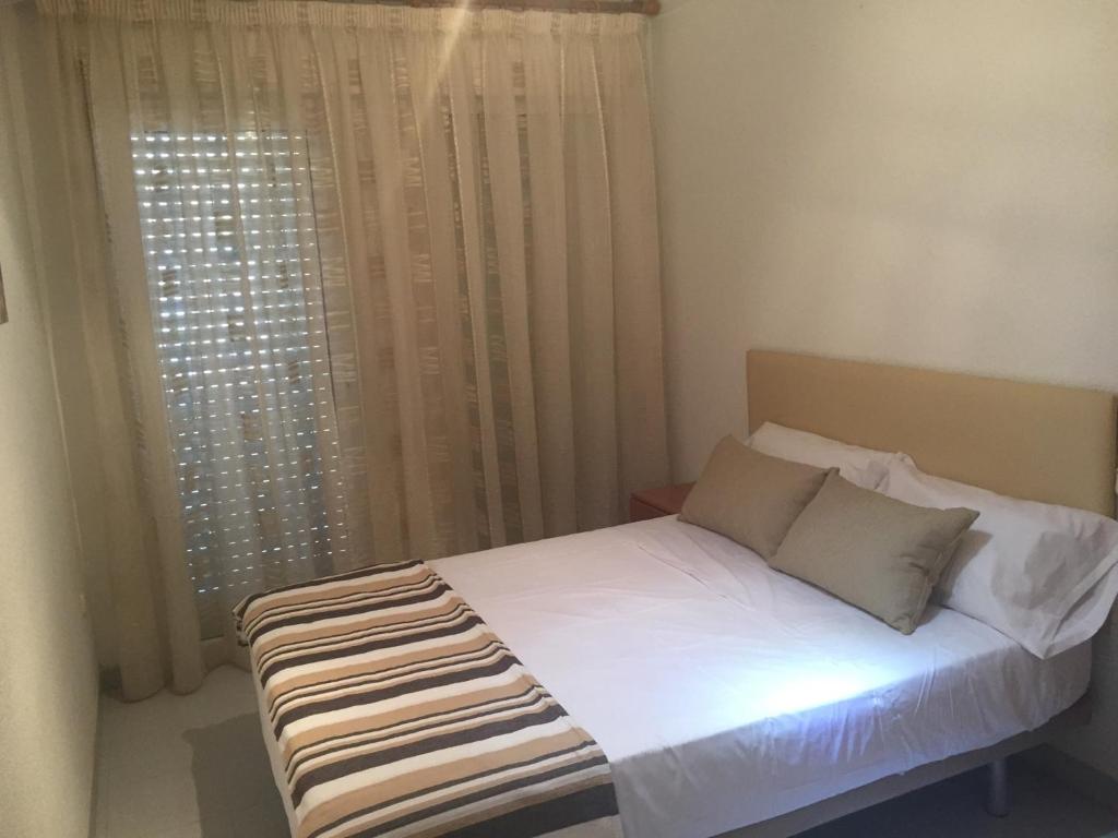 Postel nebo postele na pokoji v ubytování 1 Calle del Mar Apartamento