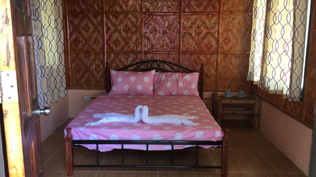 Postel nebo postele na pokoji v ubytování Anda Poseidon’s Beach Resort