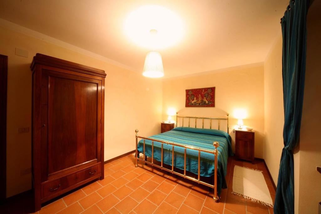 Postel nebo postele na pokoji v ubytování Agriturismo Caiburroni