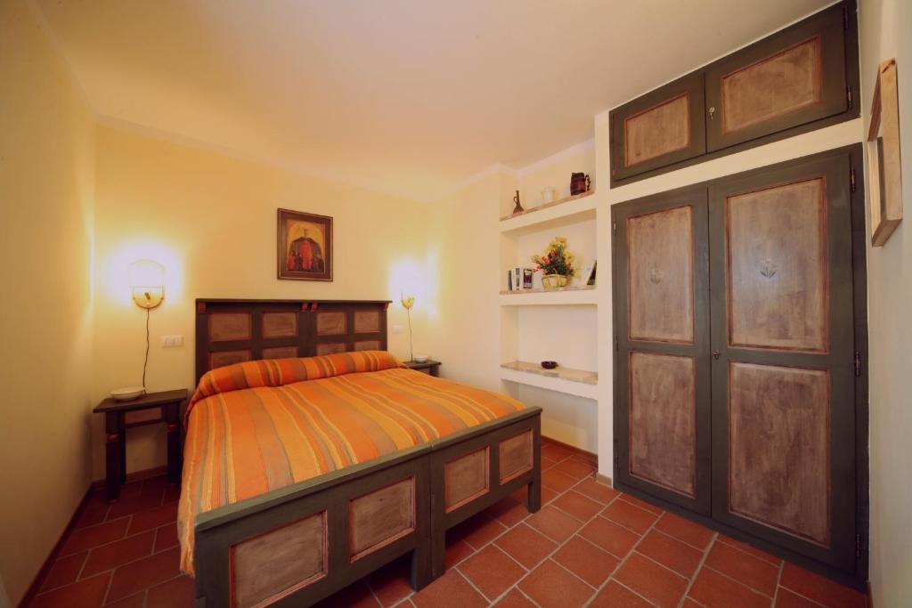 Postel nebo postele na pokoji v ubytování Agriturismo Caiburroni