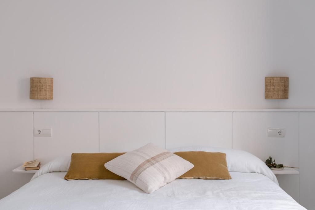 A bed or beds in a room at Ecoturisme Mas Ribas
