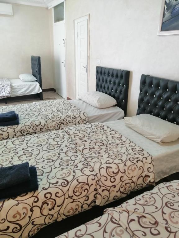 Posteľ alebo postele v izbe v ubytovaní Hamoudah Hotel