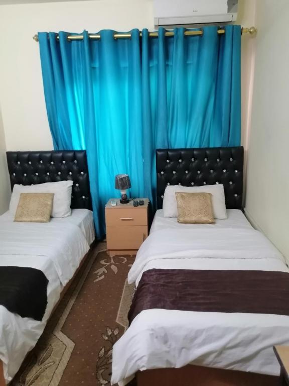 Posteľ alebo postele v izbe v ubytovaní Hamoudah Hotel
