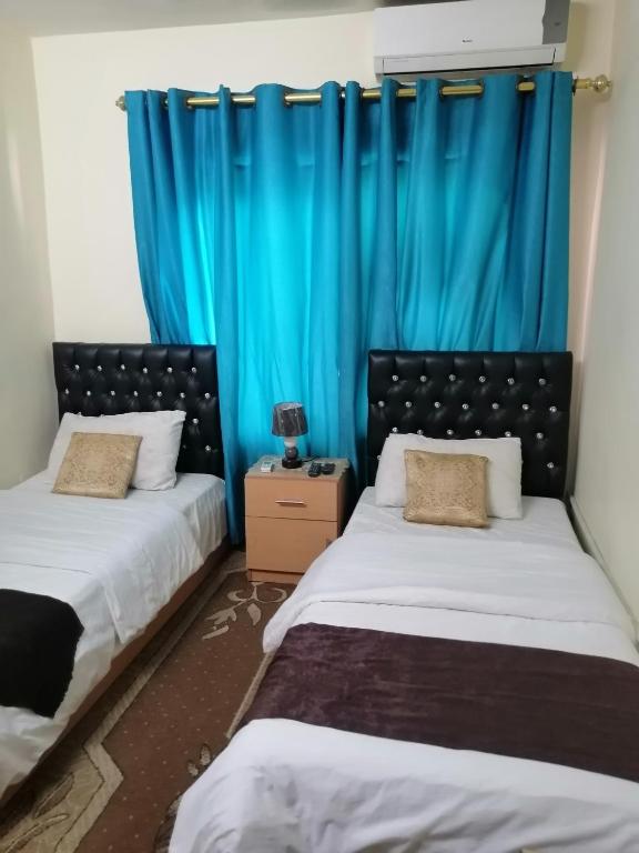 Posteľ alebo postele v izbe v ubytovaní Hamoudah Hotel
