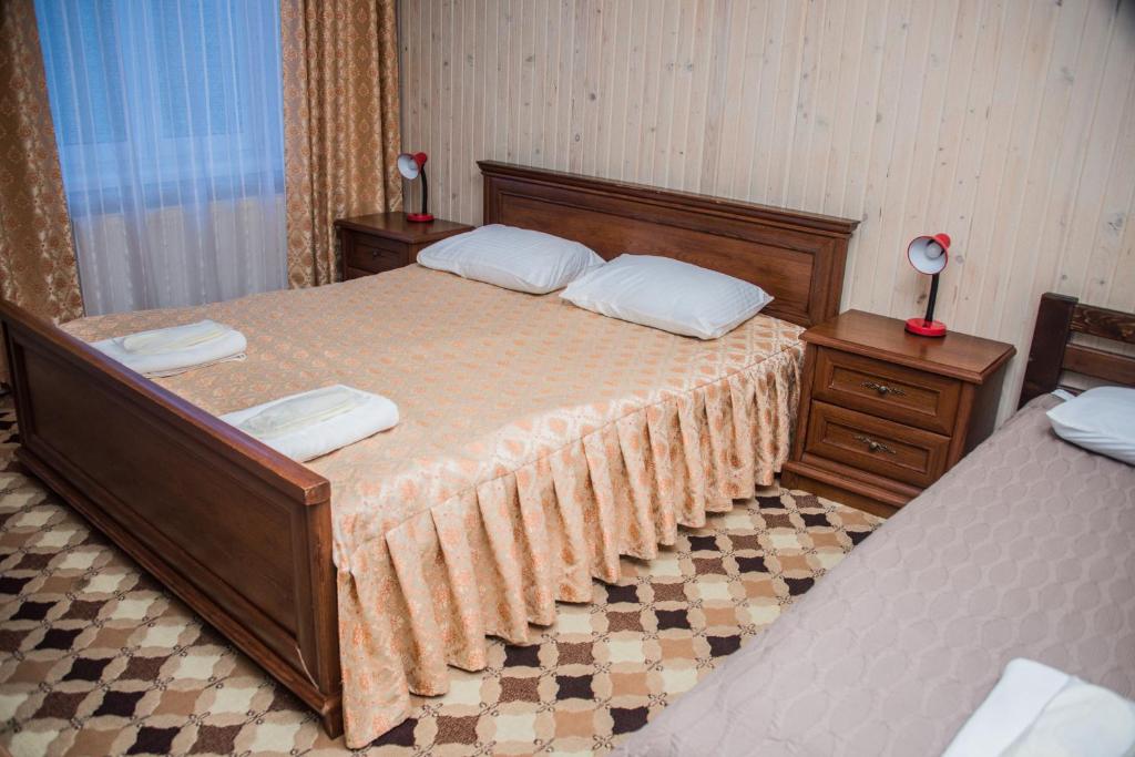 Postel nebo postele na pokoji v ubytování Olga Hotel SPA