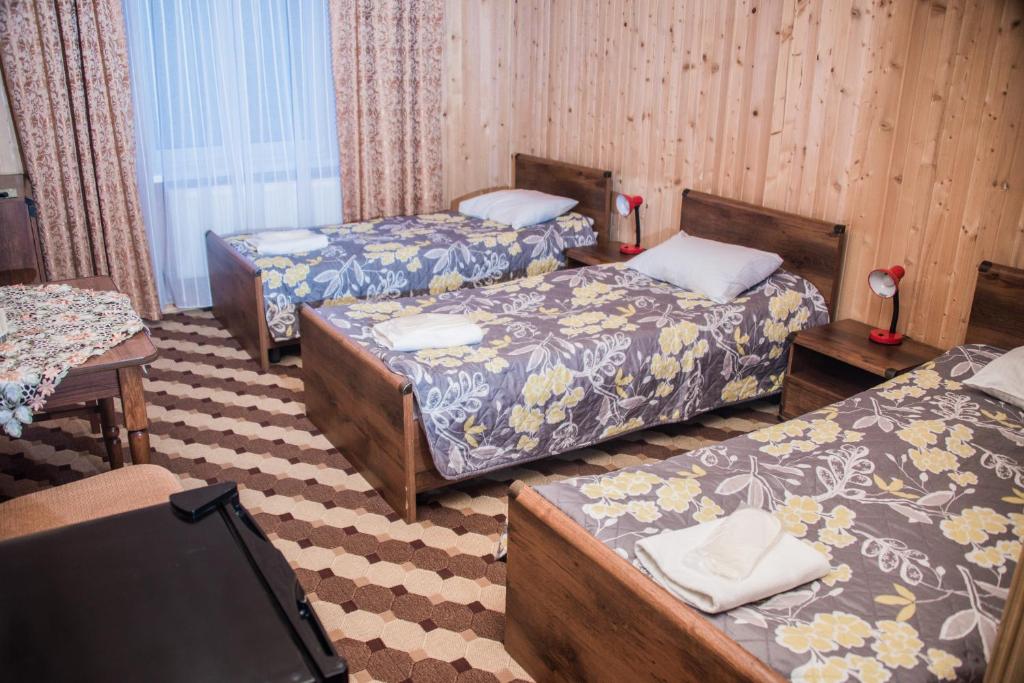 Postel nebo postele na pokoji v ubytování Olga Hotel SPA