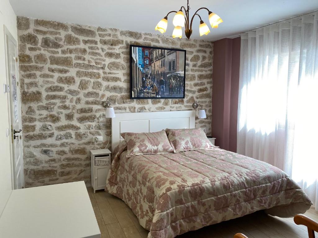 Posteľ alebo postele v izbe v ubytovaní La Morada del Cid Burgos