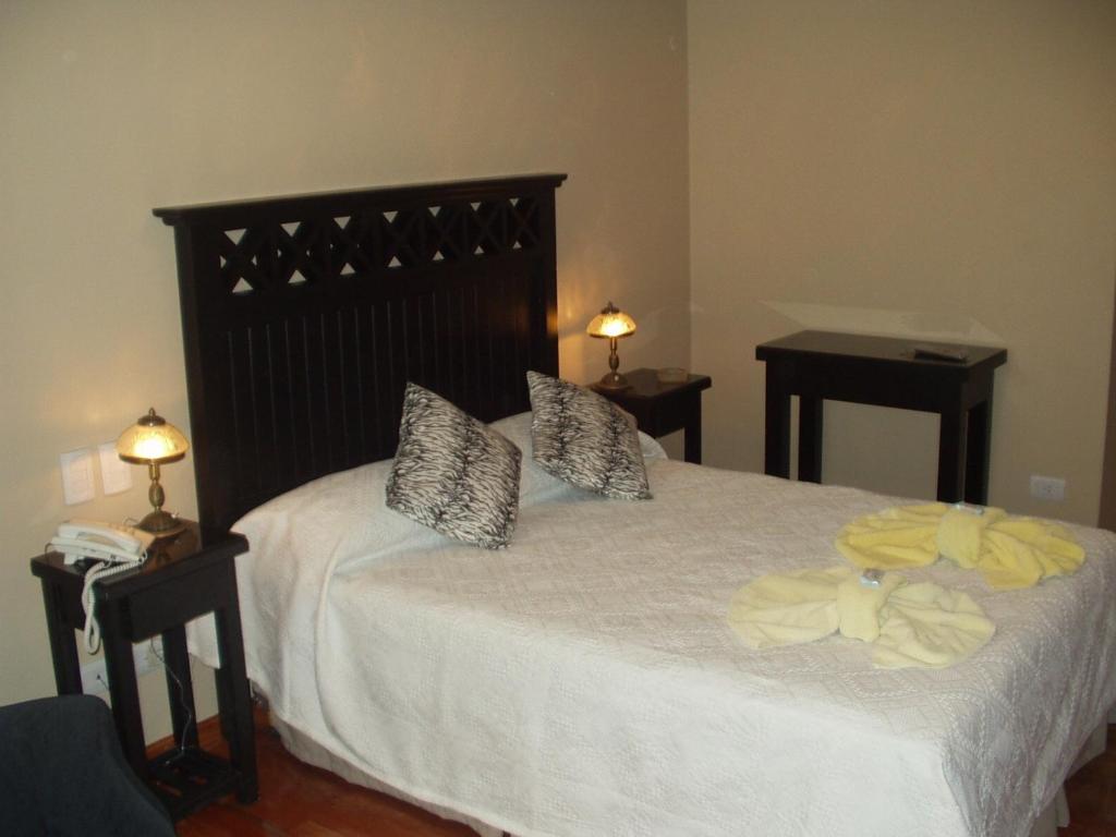 En eller flere senge i et værelse på Hotel Brisolei