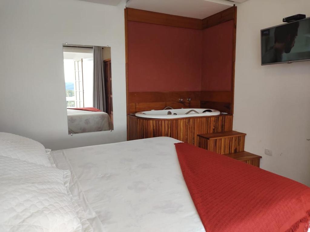 Postel nebo postele na pokoji v ubytování Pousada Casa Pinha