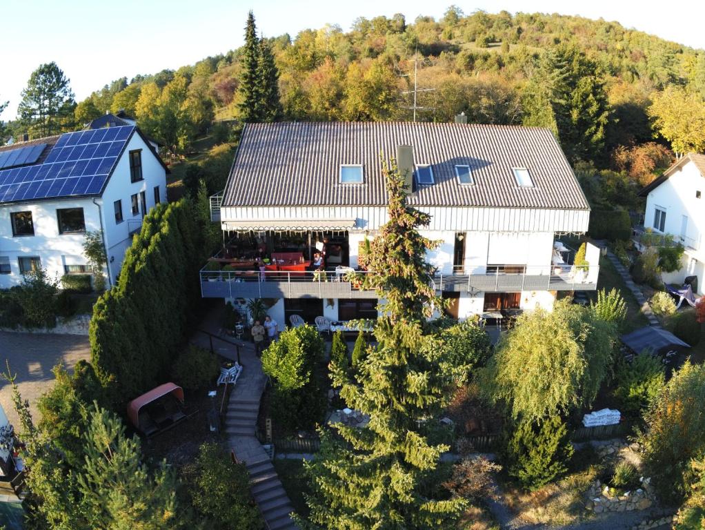 an aerial view of a house with a solar roof at 'Tor zum Schwarzwald' Ferienwohnungen in Wildberg