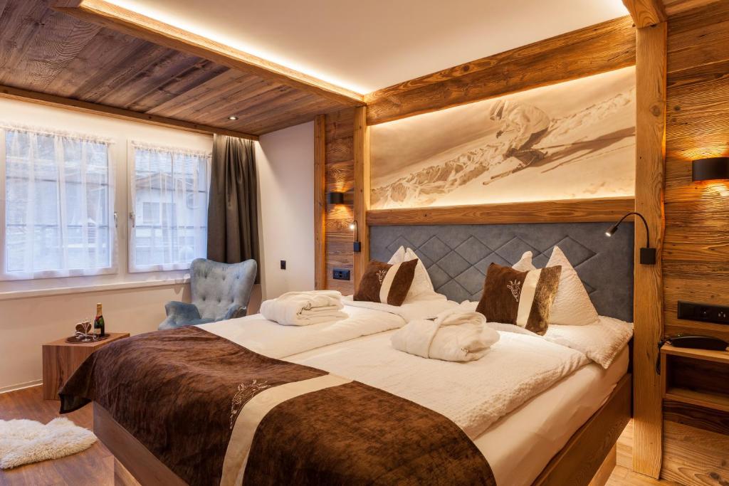 Postel nebo postele na pokoji v ubytování Silvana Mountain Hotel