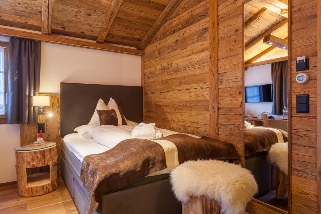Postel nebo postele na pokoji v ubytování Silvana Mountain Hotel