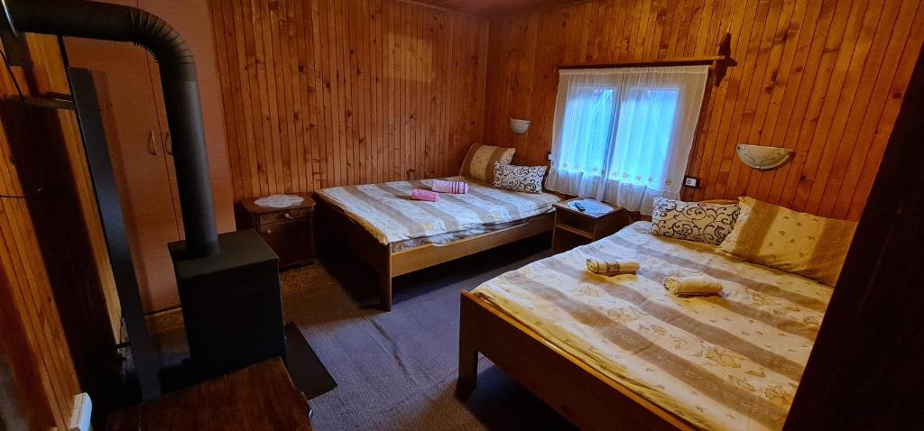 Postel nebo postele na pokoji v ubytování Domacinstvo Prentovic