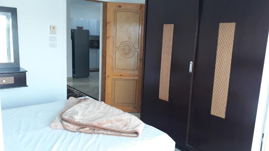 Postel nebo postele na pokoji v ubytování Hofni Palace Nile Niew