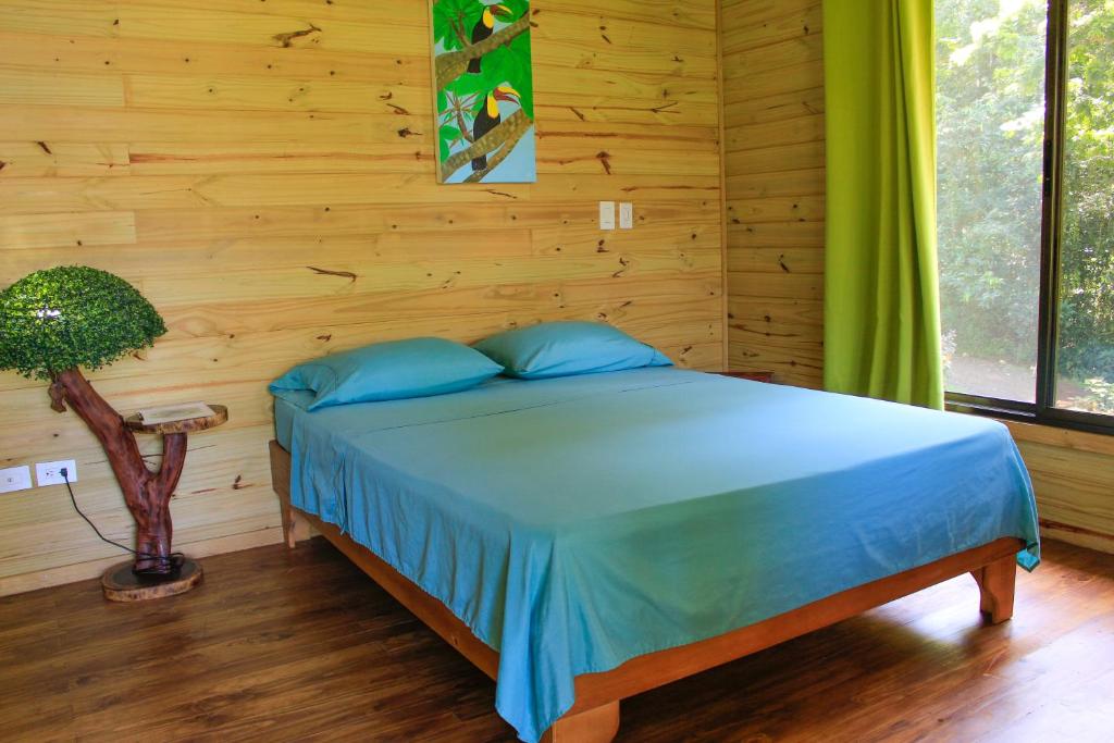 Postel nebo postele na pokoji v ubytování Forest Lodge
