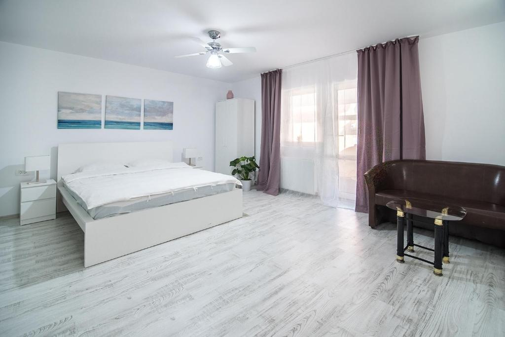 Postel nebo postele na pokoji v ubytování Transylvania Guest House