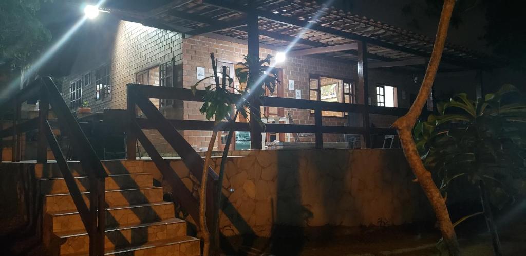 a set of stairs in front of a building at night at Gravatá Country House in Gravatá