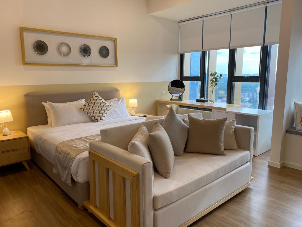 Voodi või voodid majutusasutuse Ceylonz Suites by MyKey toas