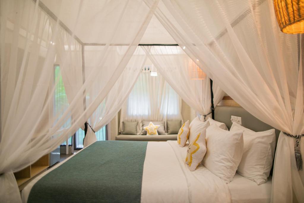 A bed or beds in a room at The Forty Eight Resort Candidasa