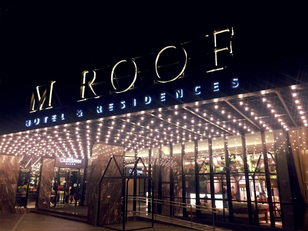 a building with a sign for the rolex store at M Roof Hotel & Residences in Ipoh