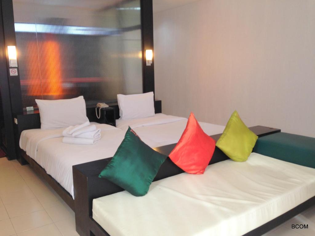 Postel nebo postele na pokoji v ubytování Khun Chaweng Resort