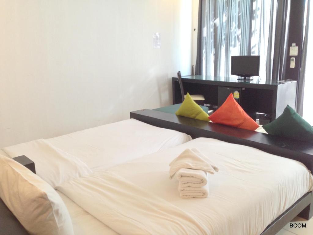 Postel nebo postele na pokoji v ubytování Khun Chaweng Resort