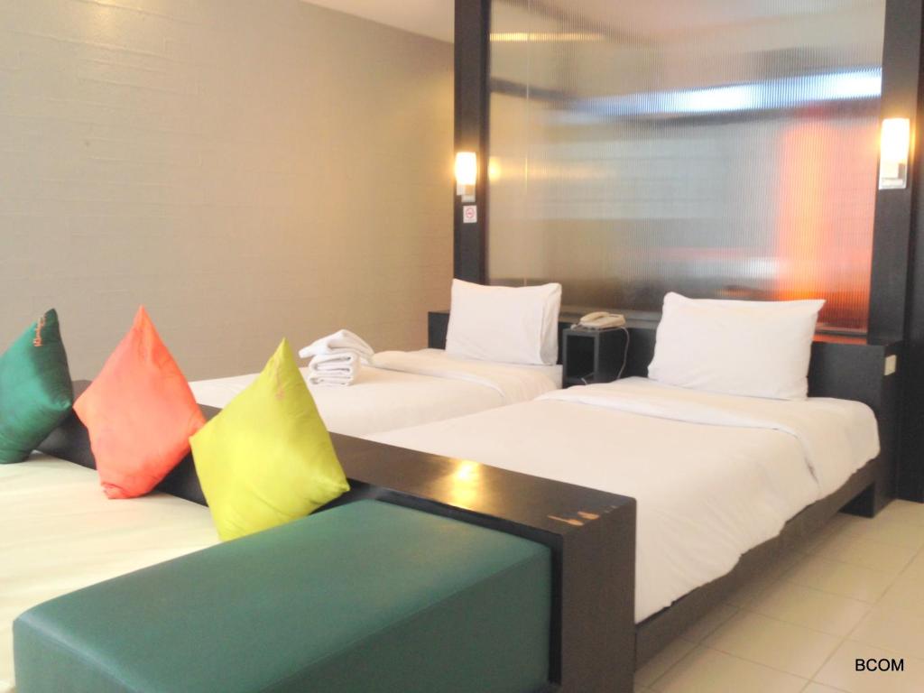 Postel nebo postele na pokoji v ubytování Khun Chaweng Resort