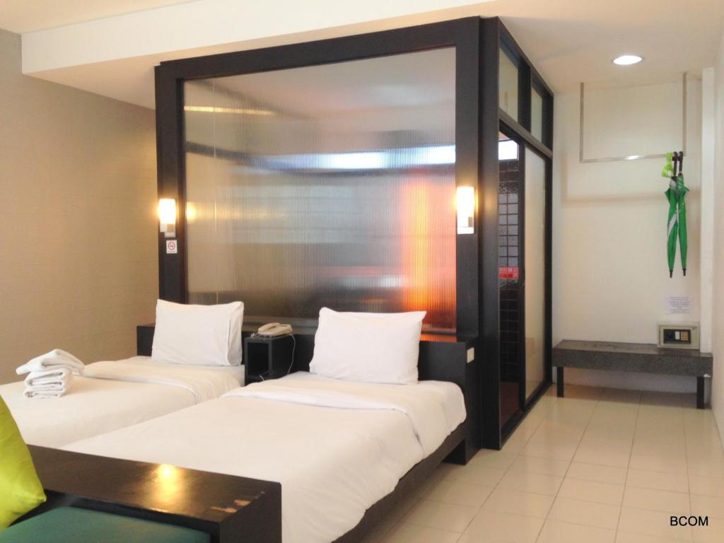 Postel nebo postele na pokoji v ubytování Khun Chaweng Resort